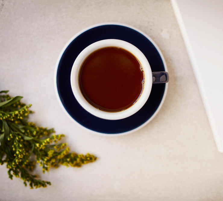 Cup of filter coffee on table